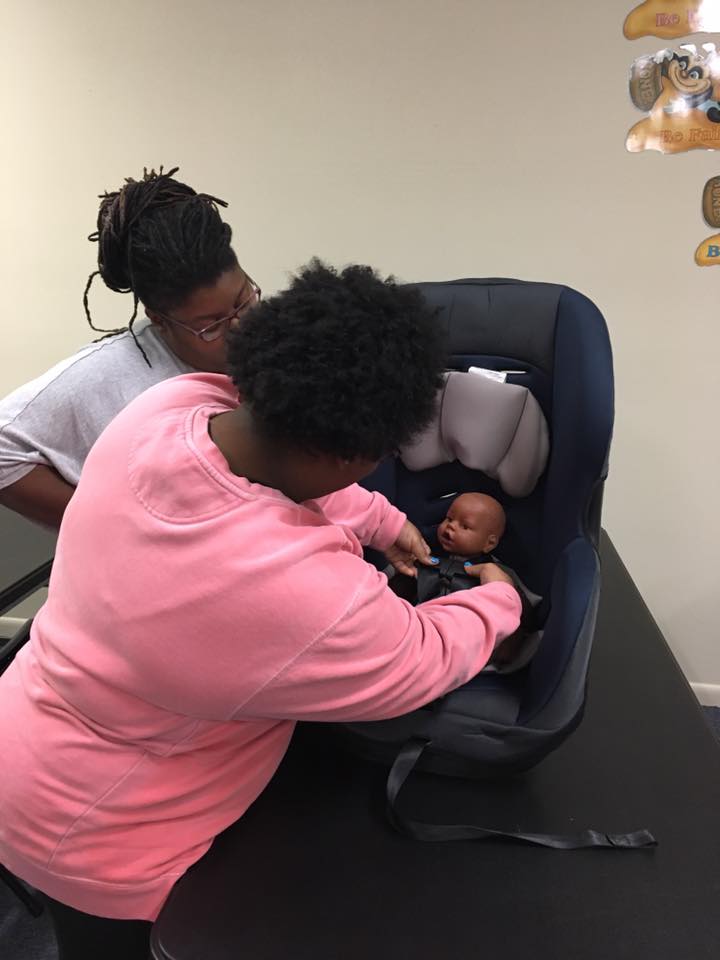 A Raising Mothers to Rise program moment with mothers and children