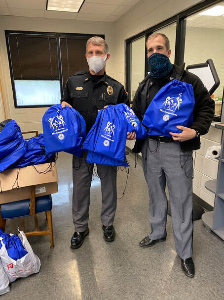 Exchange Family Center staff delivering care packages to the community